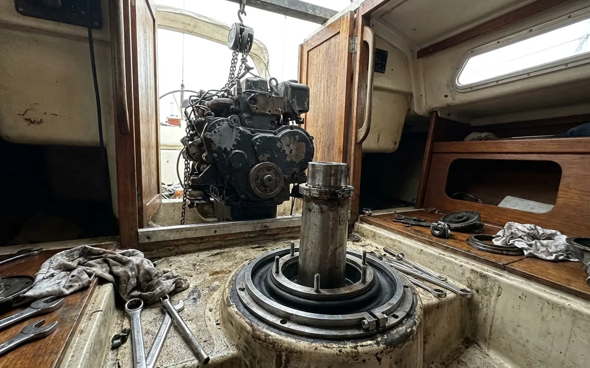 Monsun 31 engine supported forward while the saildrive diaphragm is refitted.