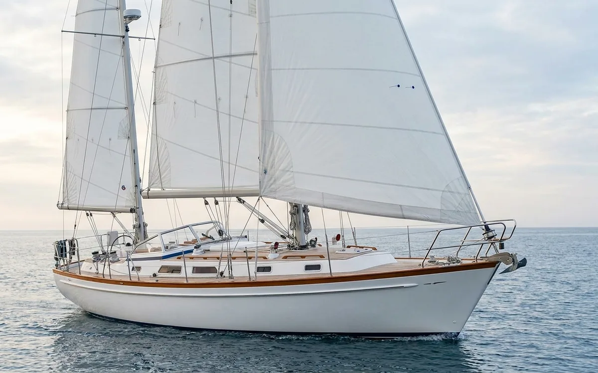 Classic Hallberg-Rassy 42 sailing under mainsail, mizzen and furling genoa.